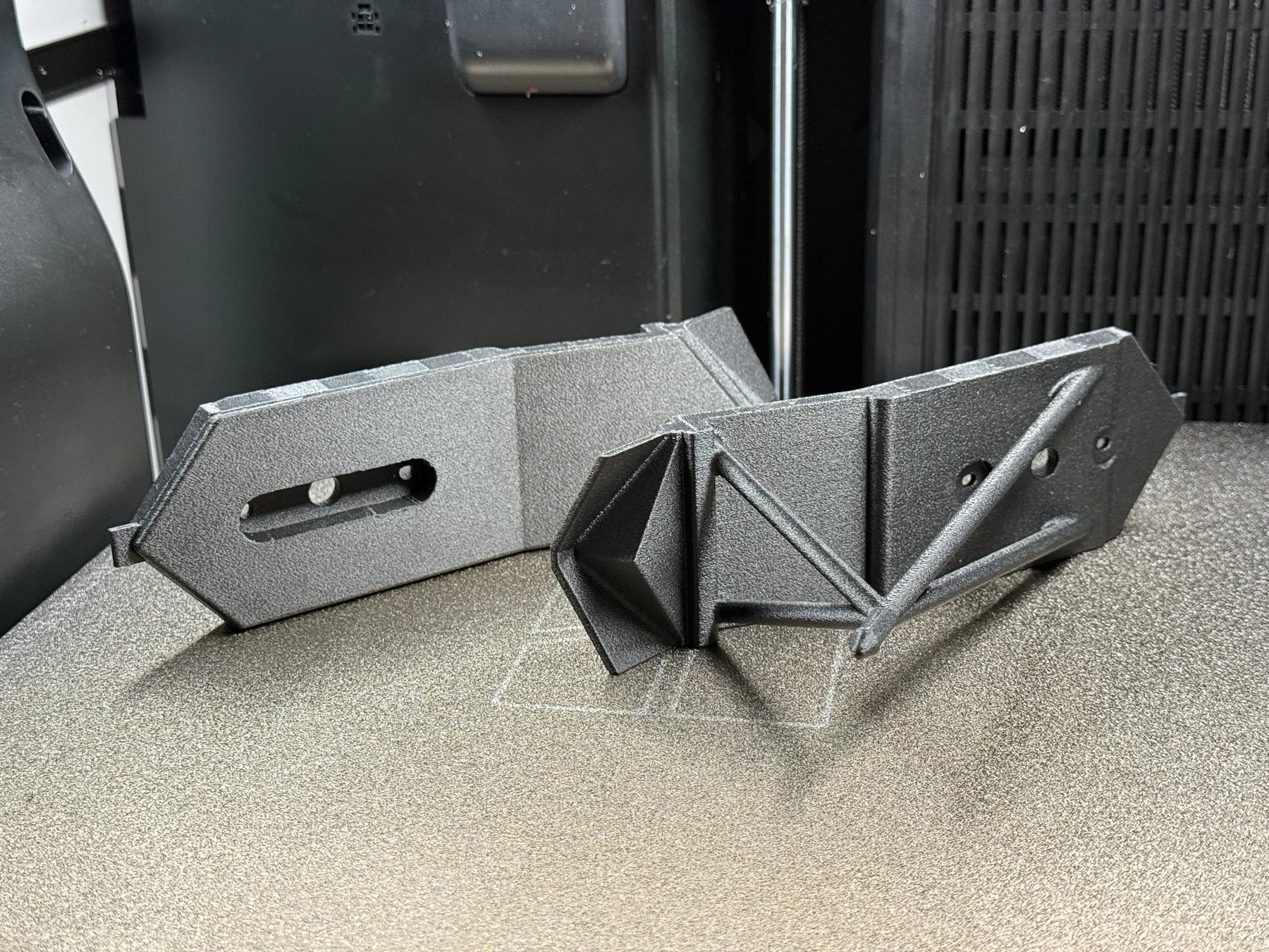 Finished ABS-CF engineering component after support removal
