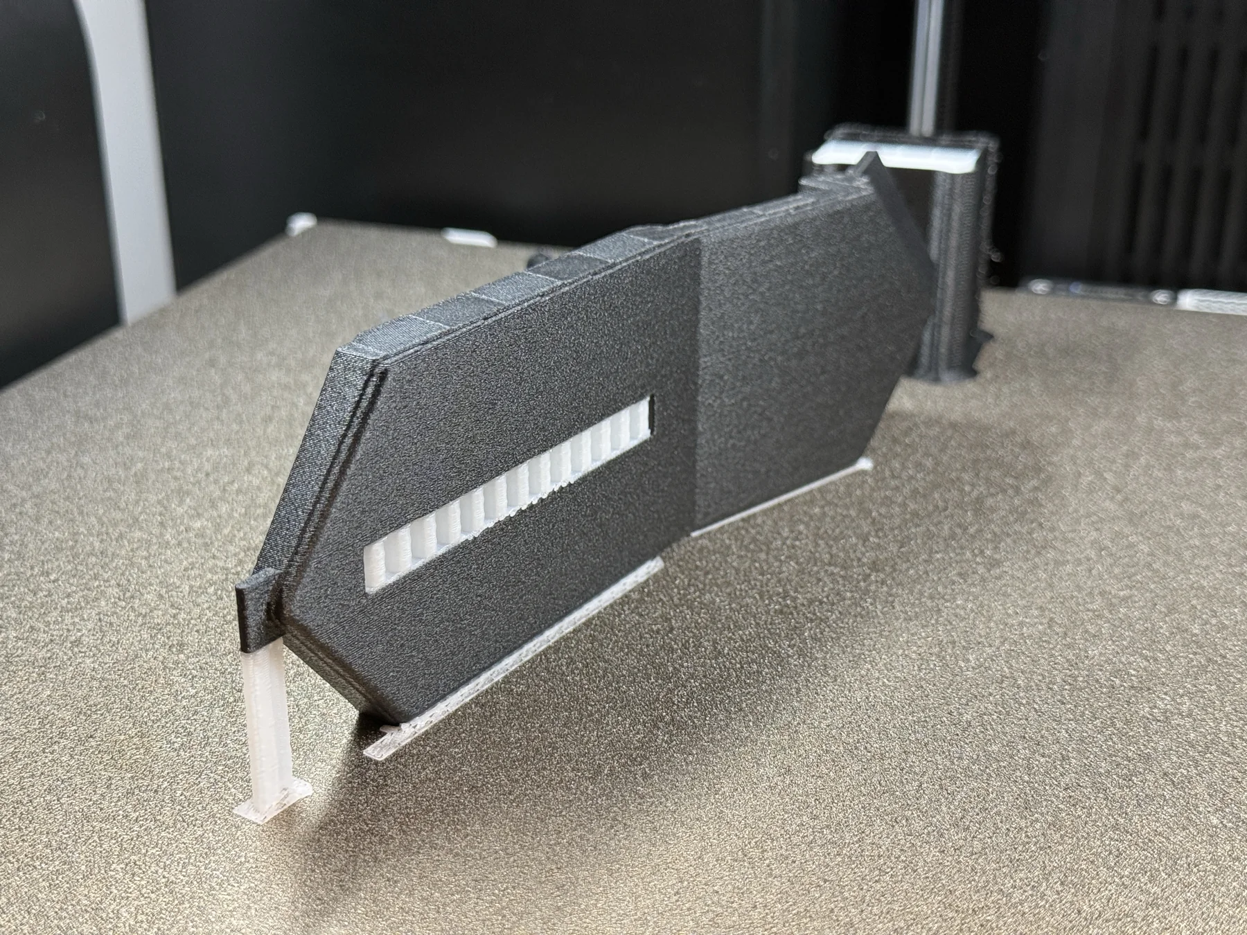 ABS-CF engineering component being produced with specialised support filament on a dual-nozzle 3D printer