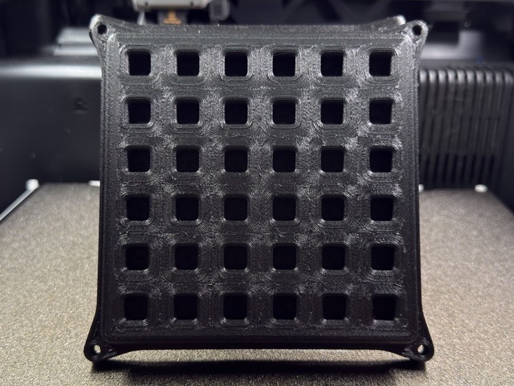 Finished black PPA-CF pool return grate made for a customer in the US Virgin Islands